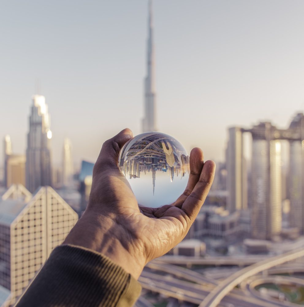 holding a glass ball